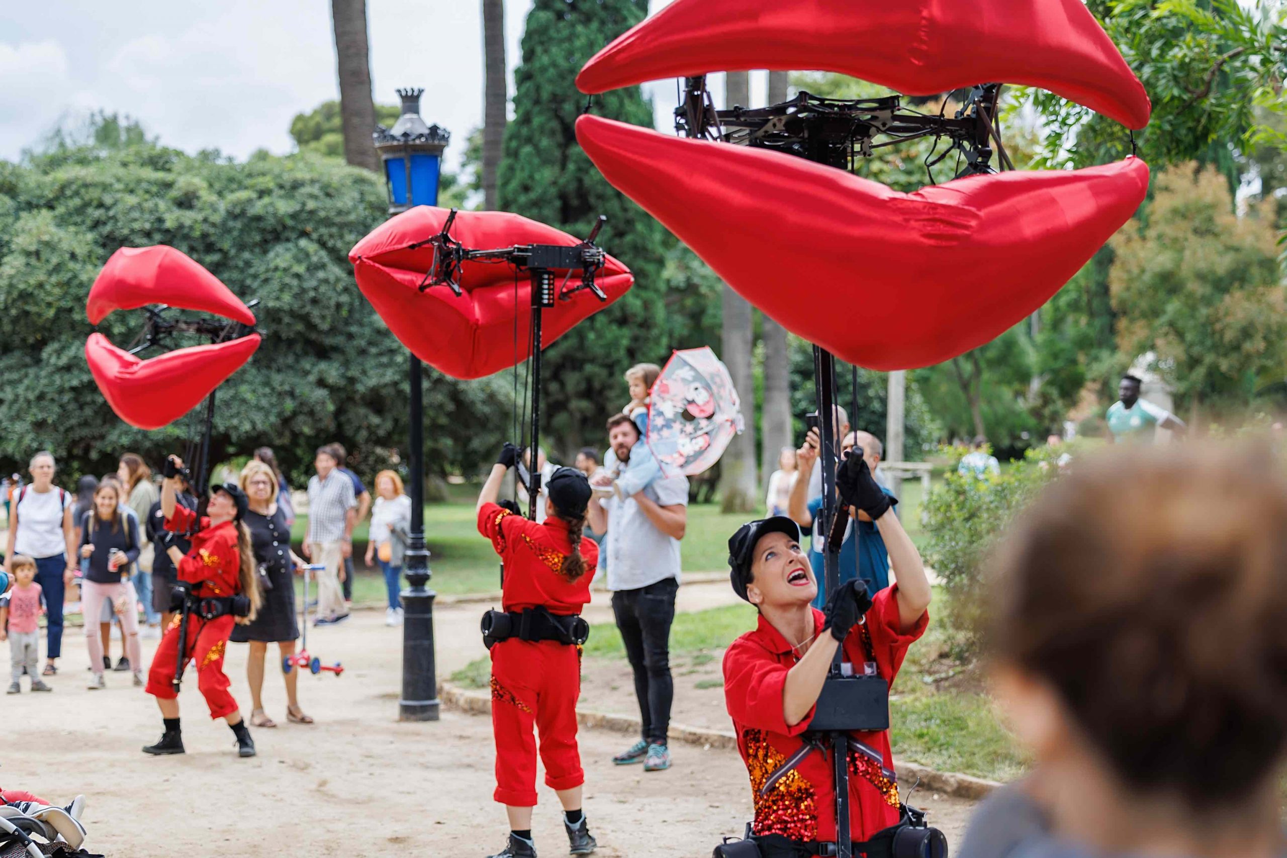 people holding puppets on a stick 